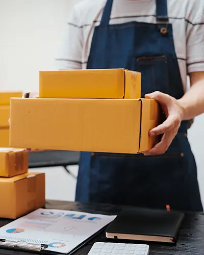 E-commerce orders ready to be shipped by worker