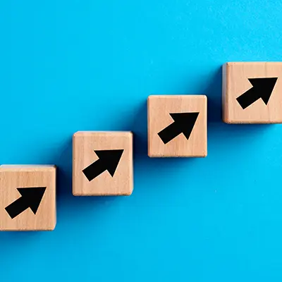 Business growth concept with arrows on blocks