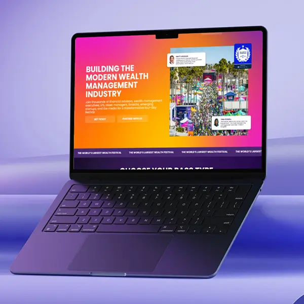 Laptop showing a vibrant WordPress homepage design for a popular event