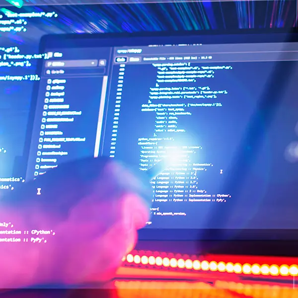 Developer working on website code with touch screen